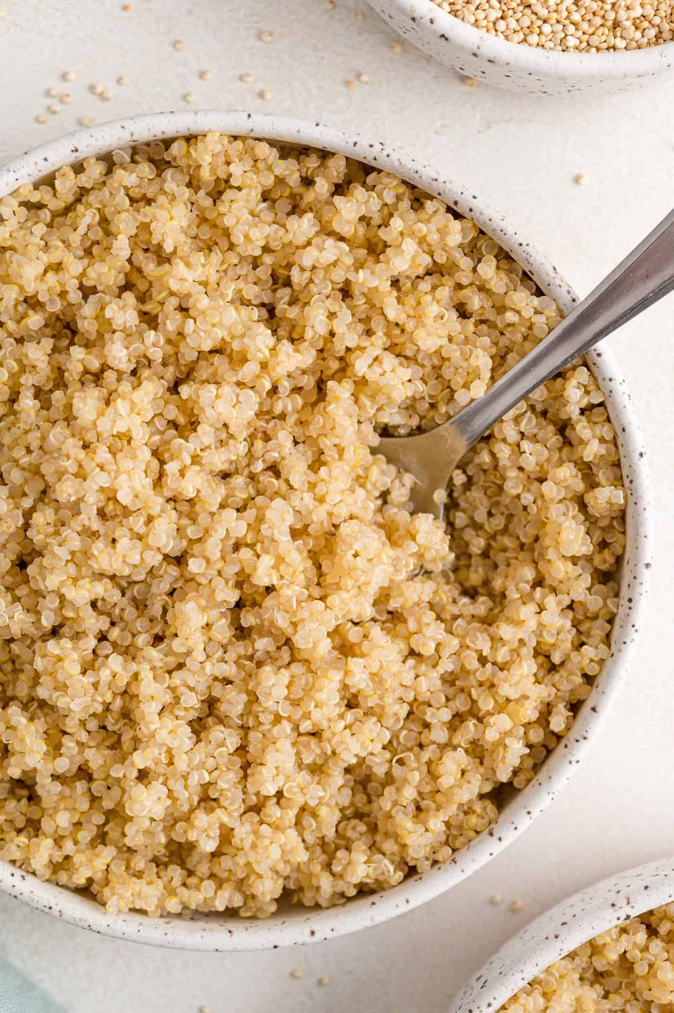 Fluffy instant pot quinoa in a round white bowl.