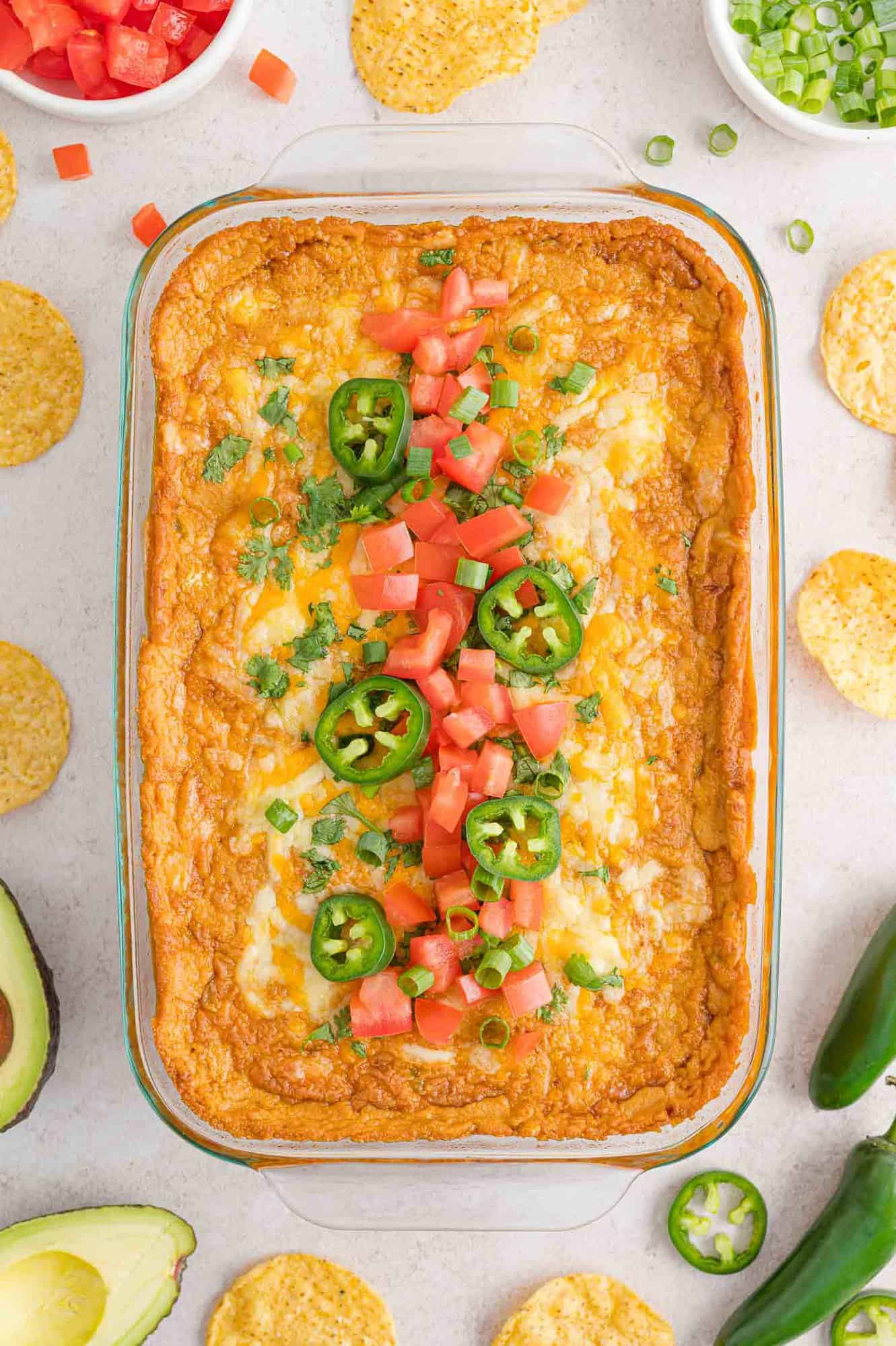 Cheesy bean dip with toppings.