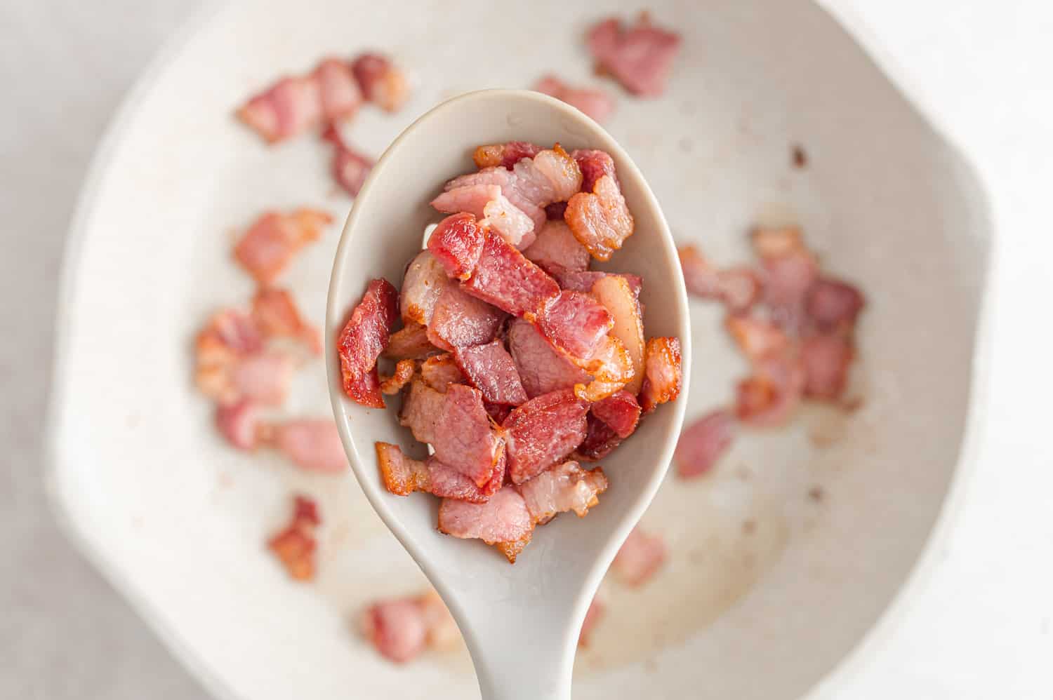 Crispy bacon in a skillet.