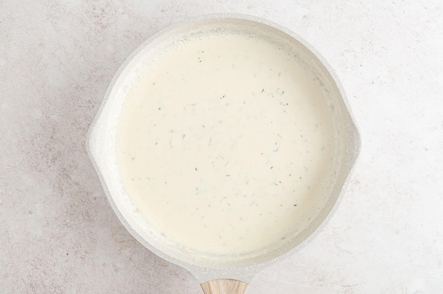 White sauce in a pan.