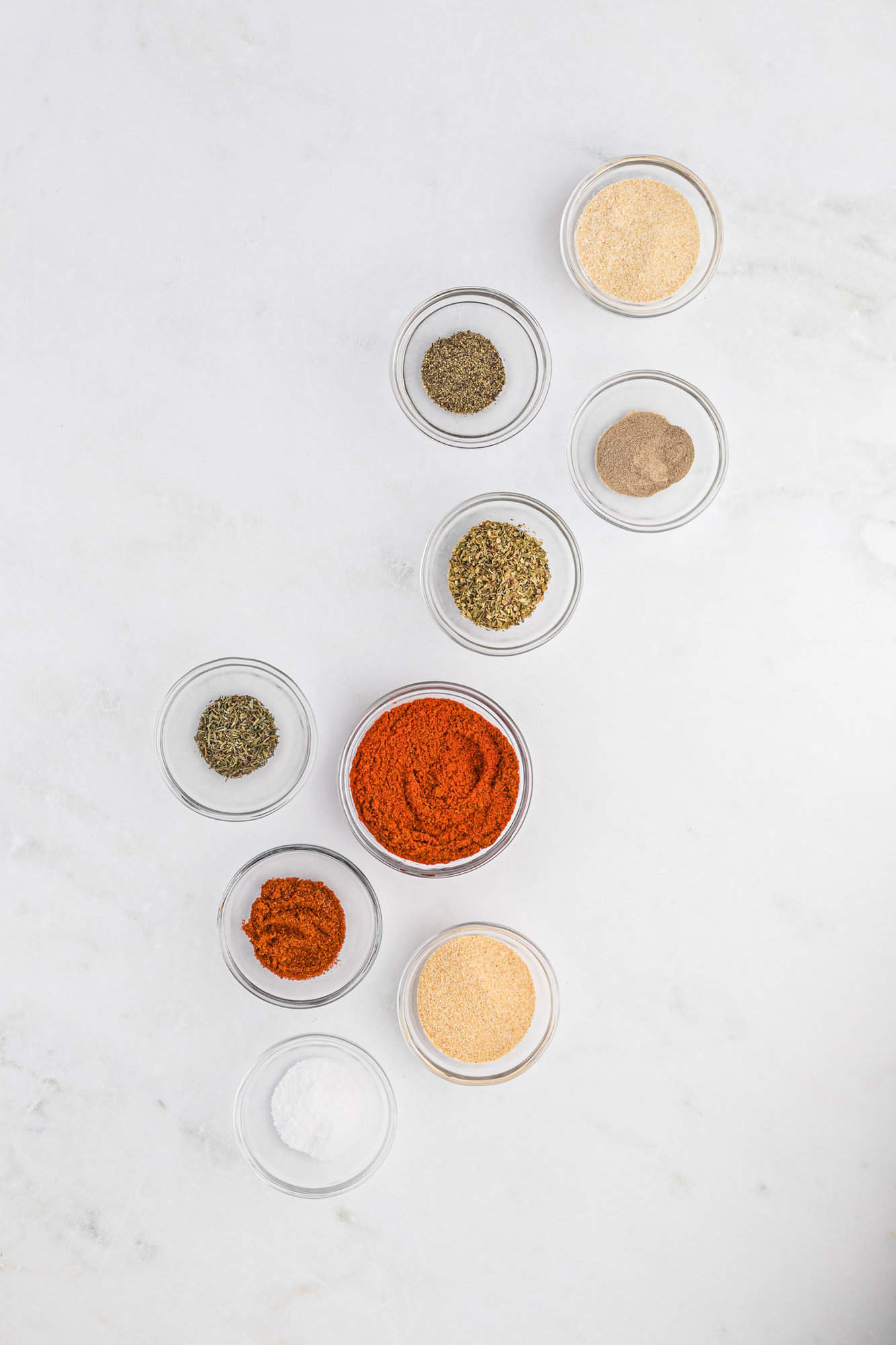 Spices in individual bowls.