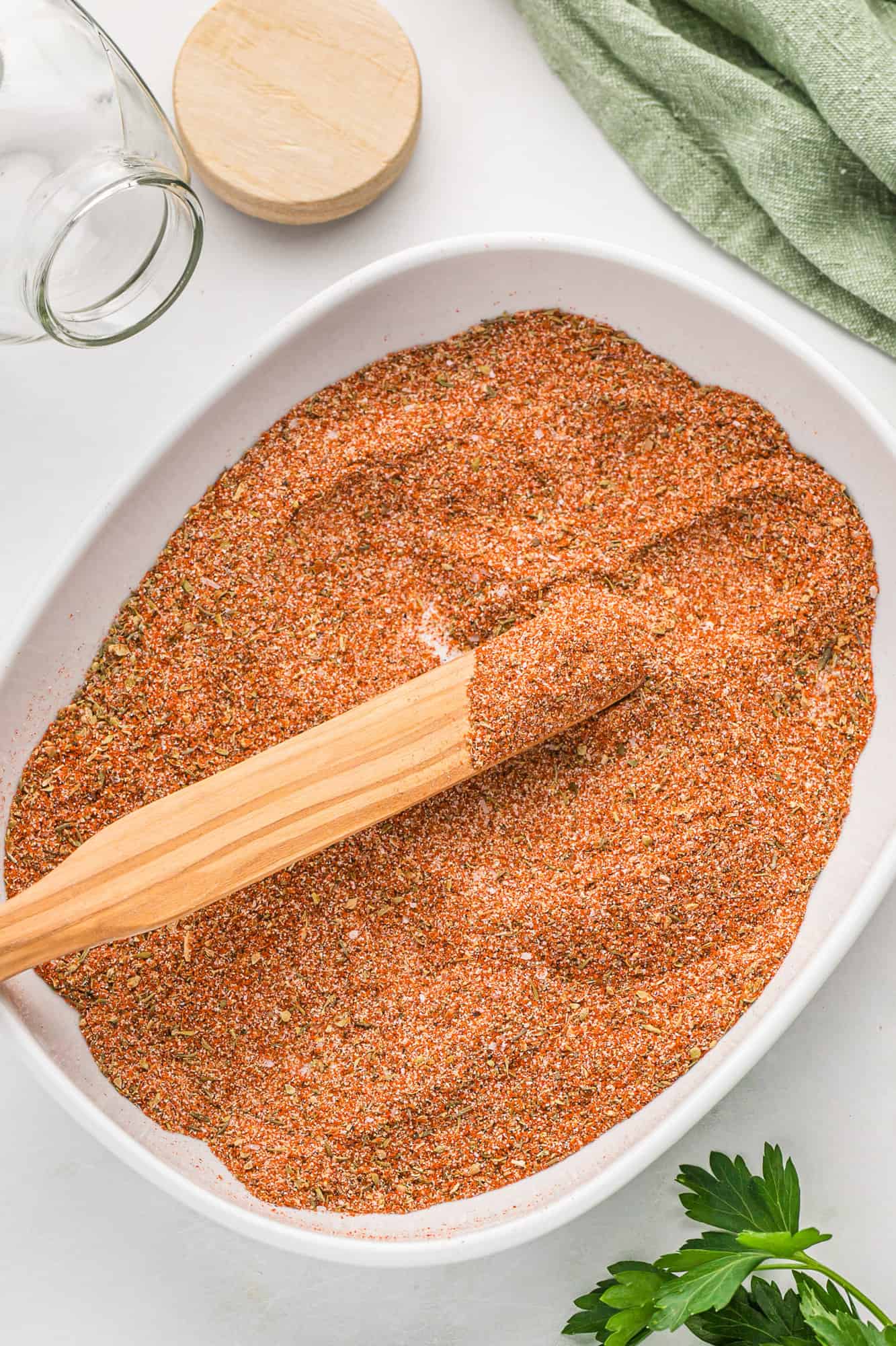 Cajun seasoning in a large shallow bowl.