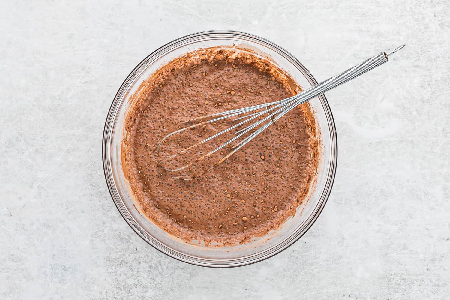 First stir of chia pudding using a whisk.