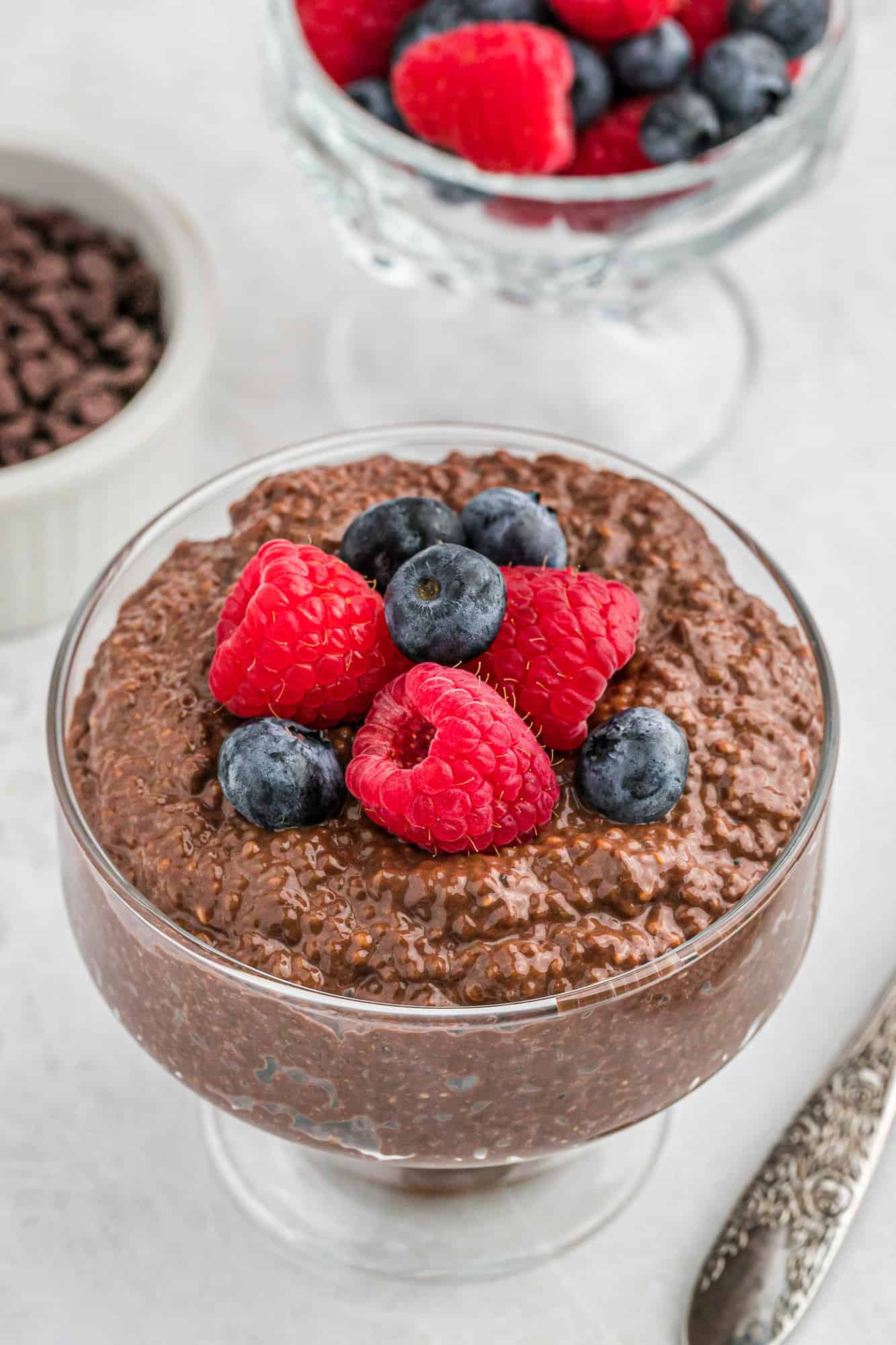 Chocolate chia seed pudding topped with berries.