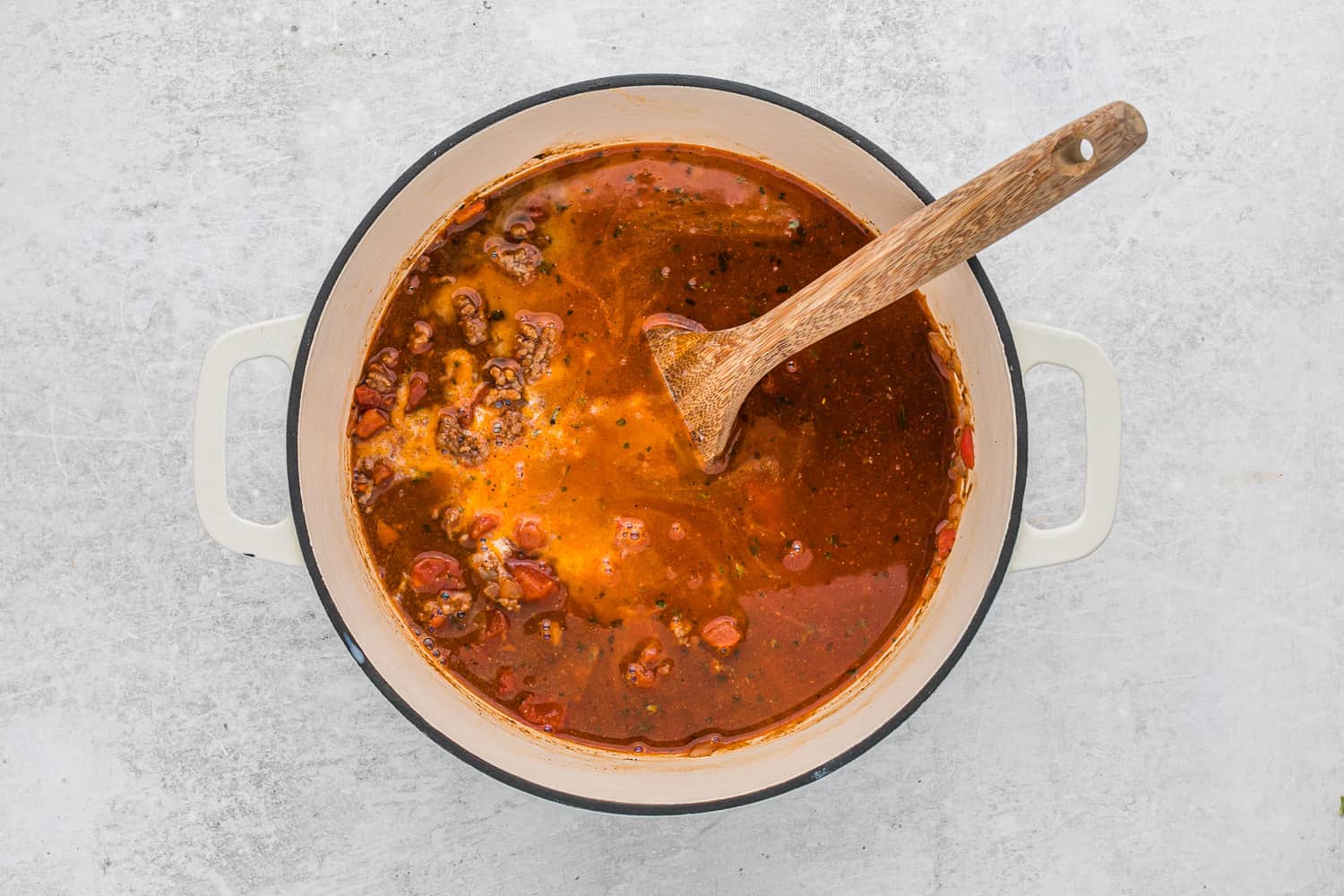 Broth and tomatoes added.