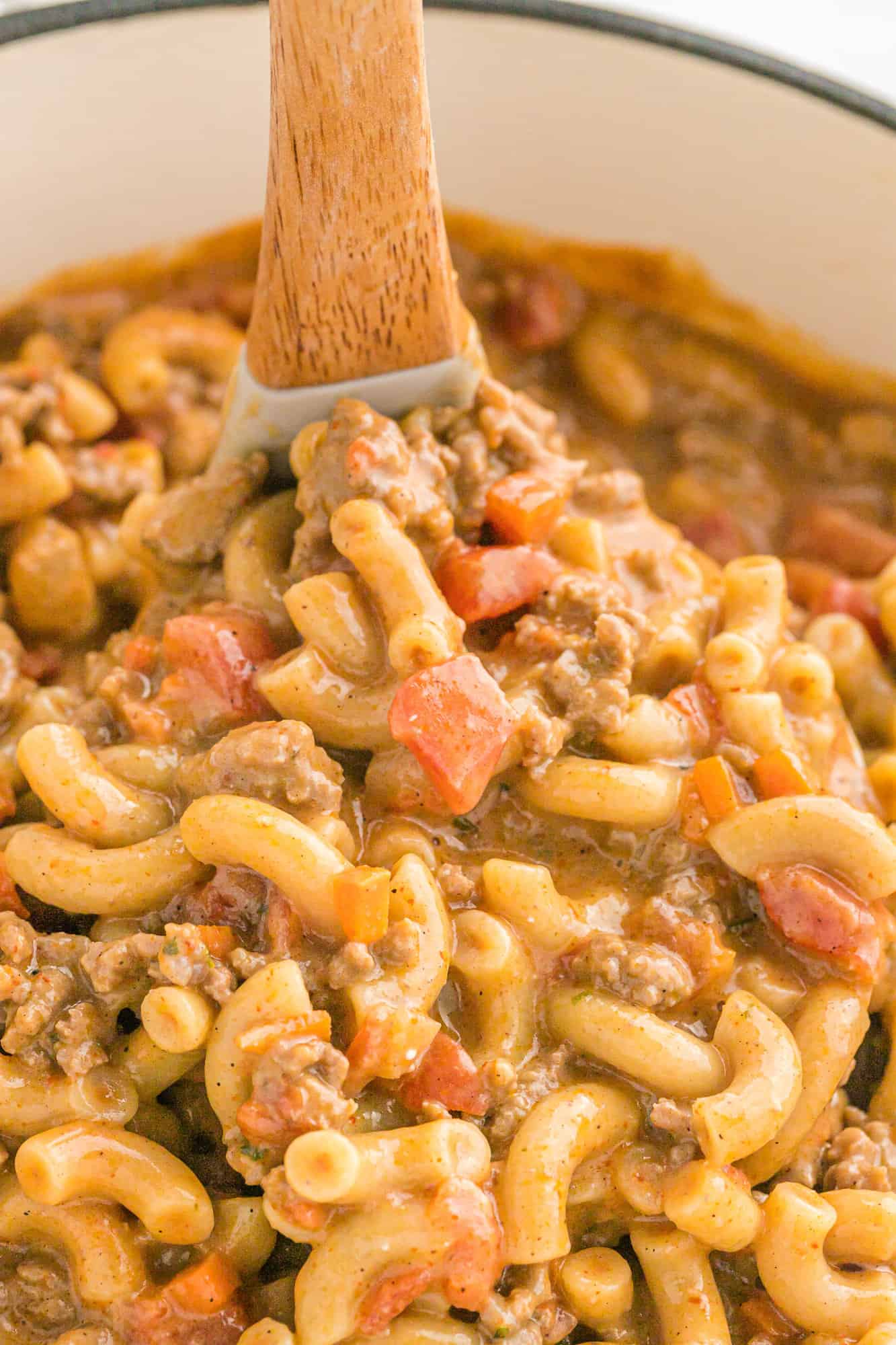 Homemade hamburger helper being scooped with a ladle.