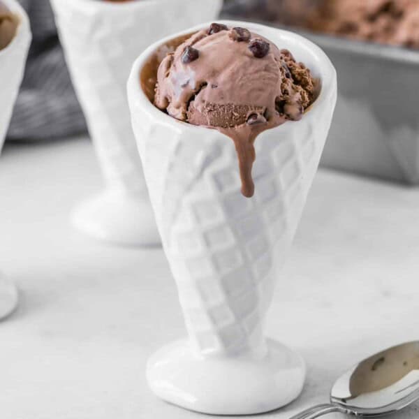 No churn chocolate ice cream in a white ceramic cone.