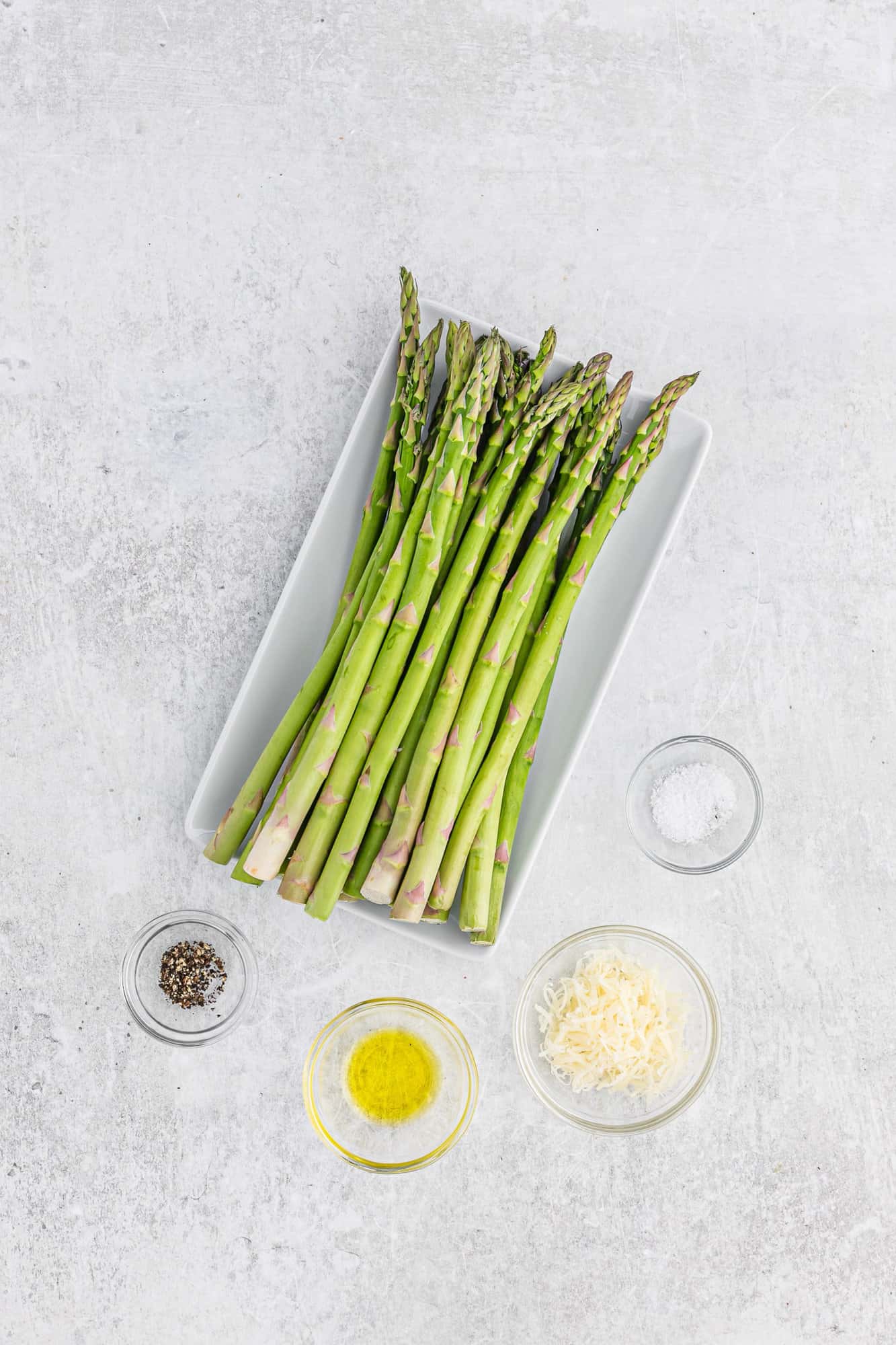 Ingredients needed including asparagus, olive oil, salt, and pepper.