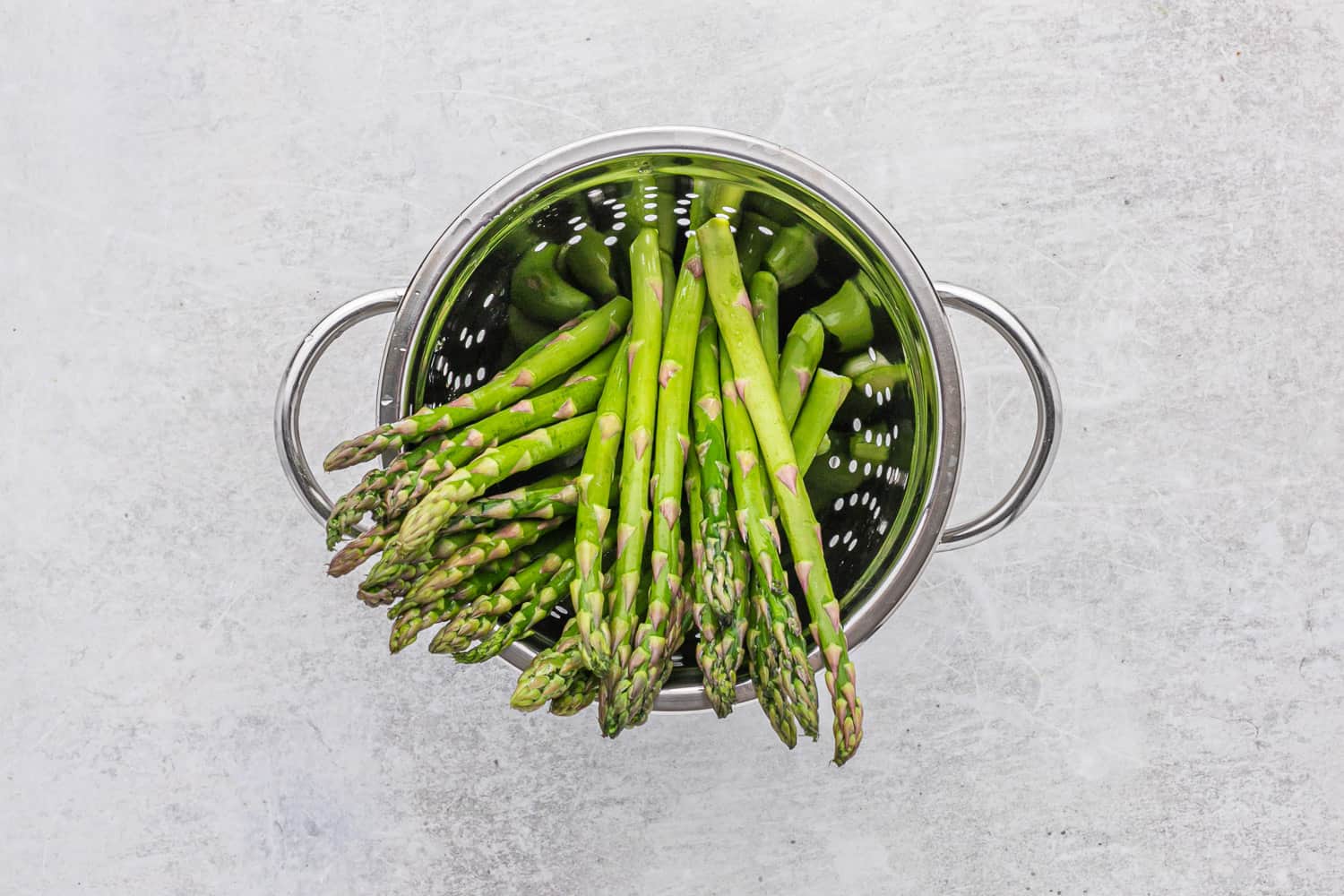 Asparagus in a colander. 