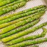 Roasted asparagus on a sheet pan.