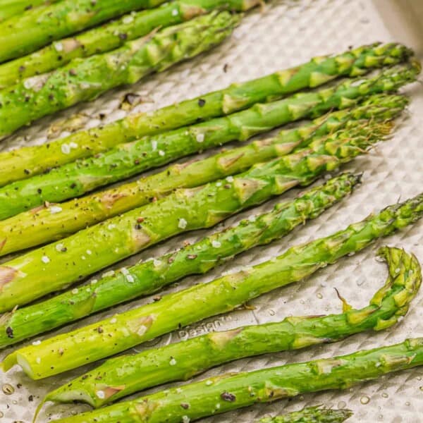 Roasted asparagus on a sheet pan.