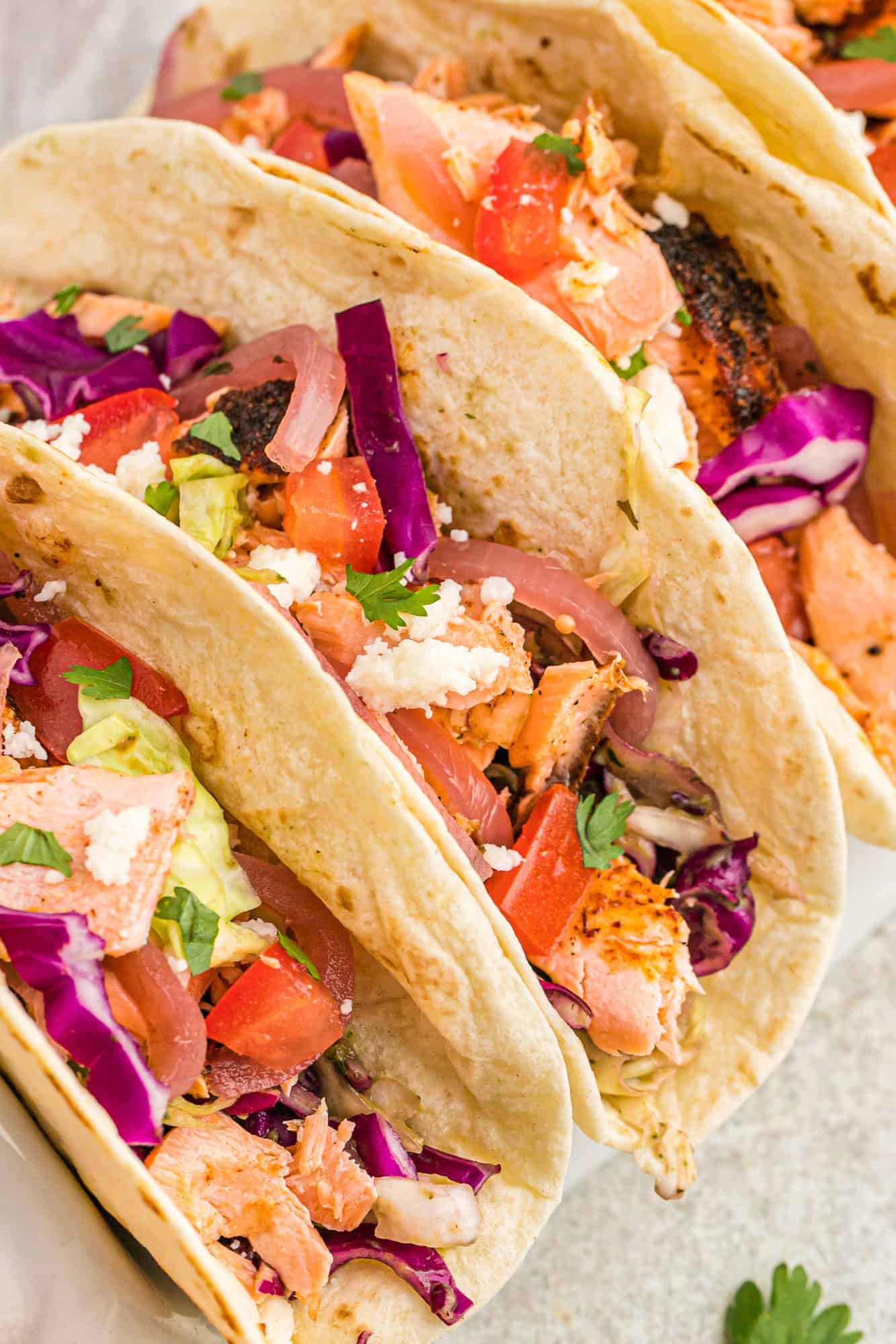 Close up view of salmon tacos.