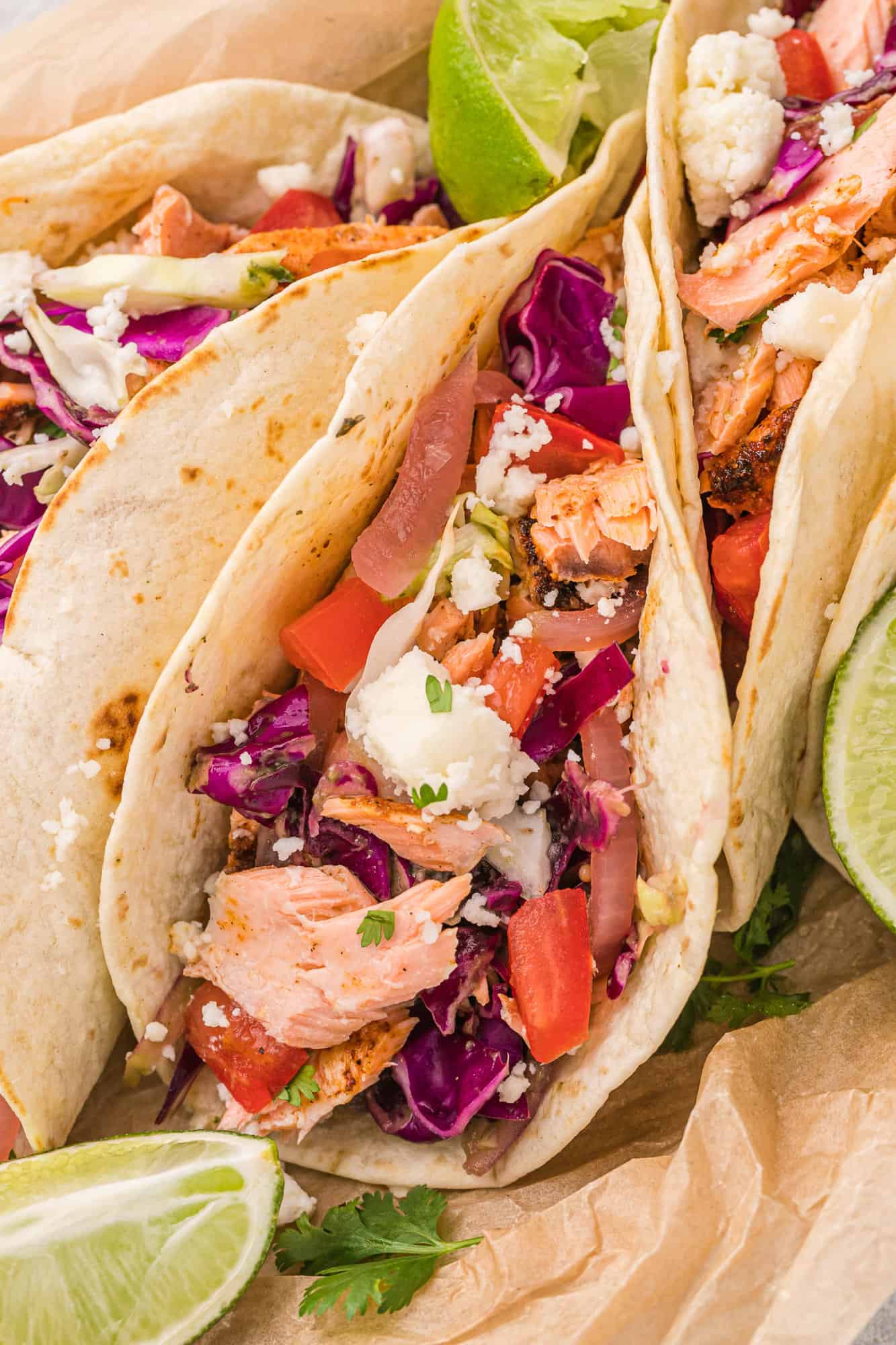 Close up of a fish taco with avocado slaw.