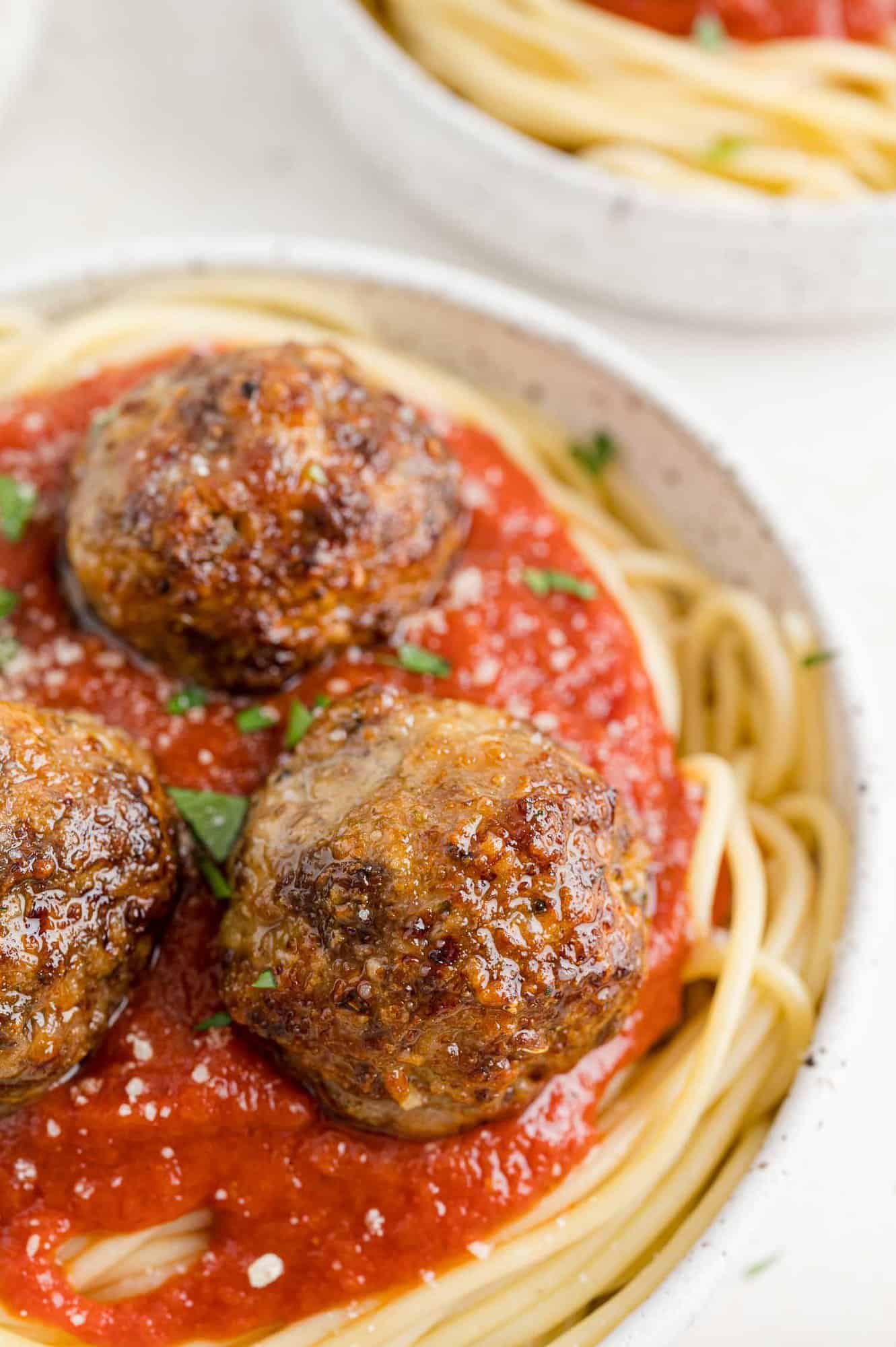 Meatballs atop spaghetti.