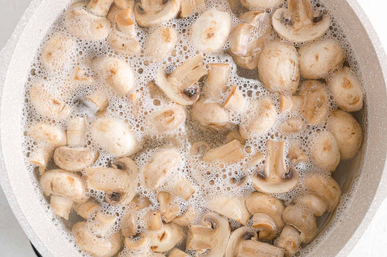 Mushrooms being boiled.