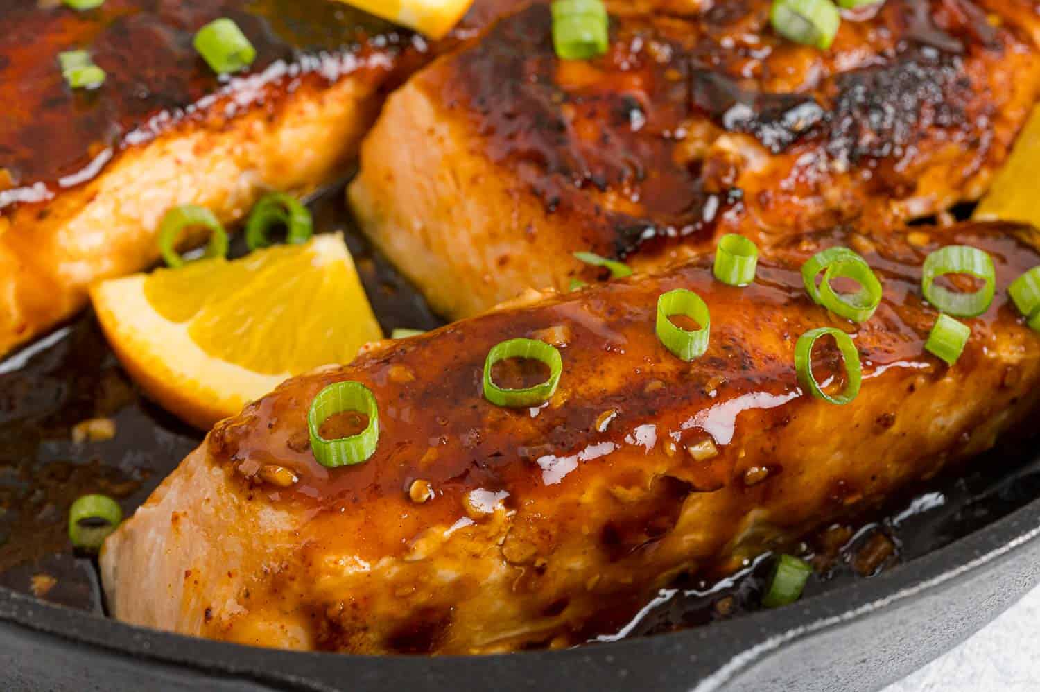 Close up of orange glazed salmon.