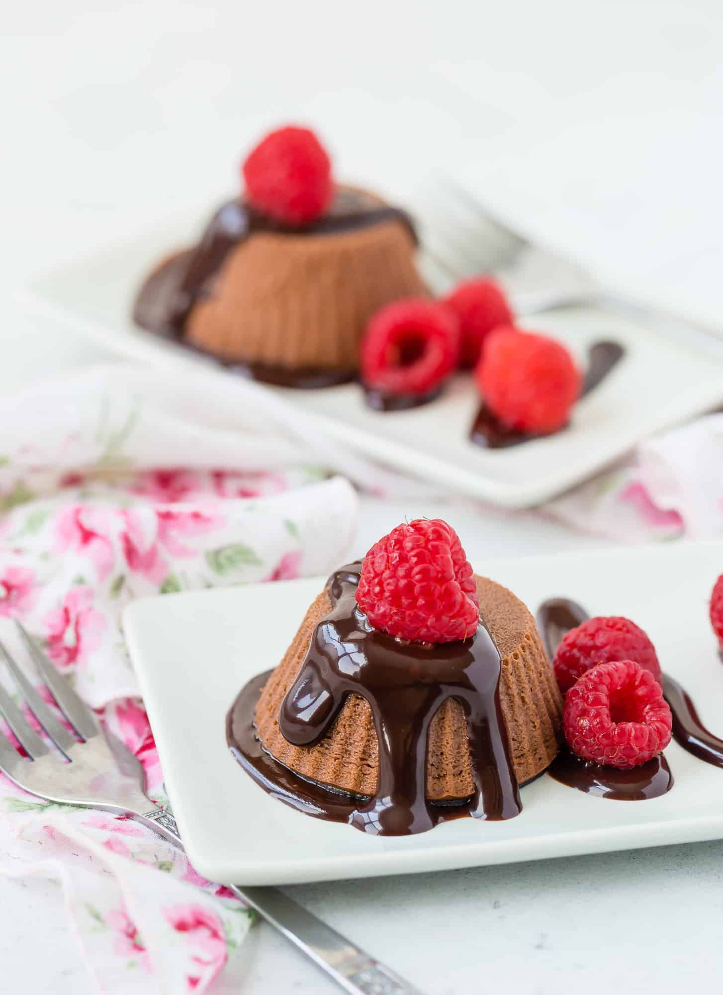 Small chocolate cake with raspberries.