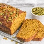 Healthy pumpkin bread, partially sliced.