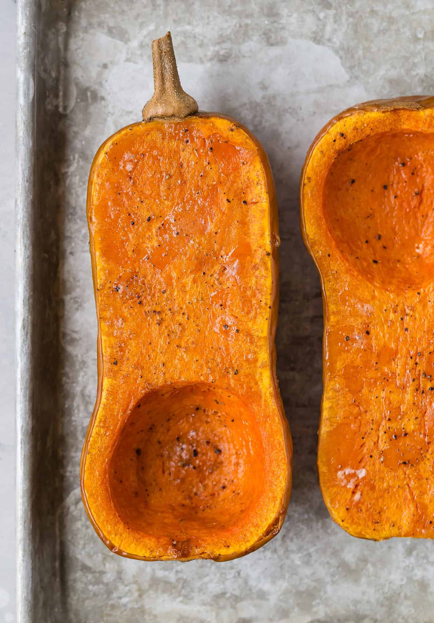 Roasted butternut squash halves.