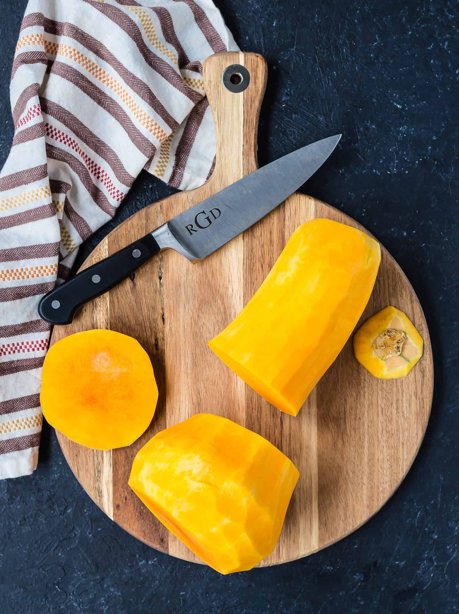 Butternut squash, peeled and cut in two pieces. Top and bottom are also cut off.