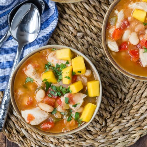 Jerk chicken chili topped with mango.