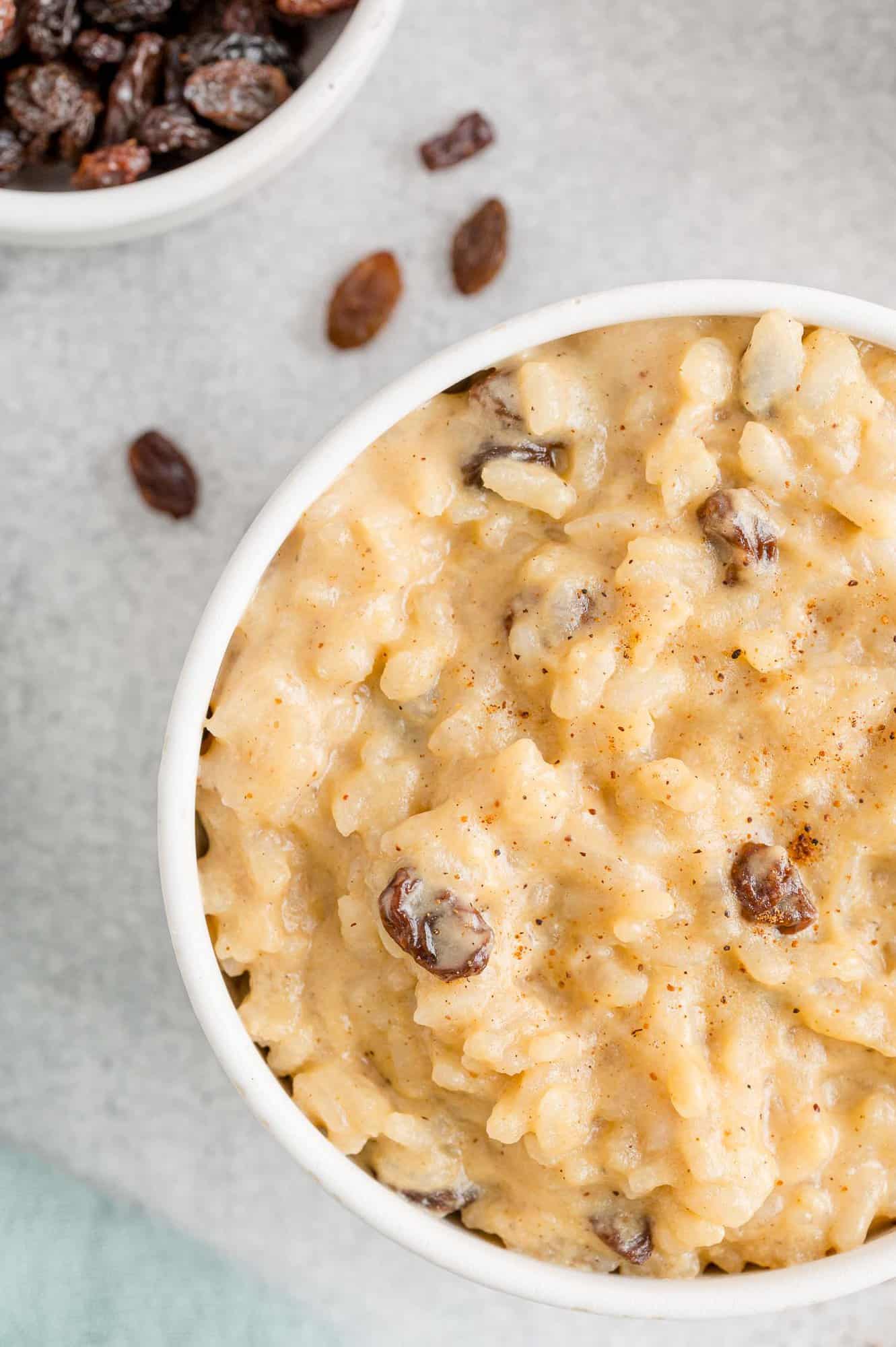 Close up of rice pudding in white bowl.