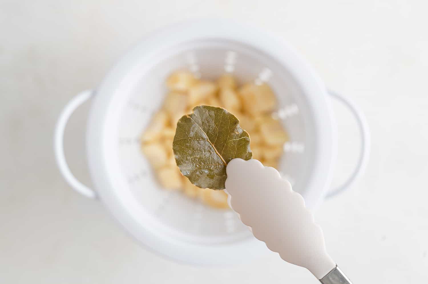 Bay leaf being removed.