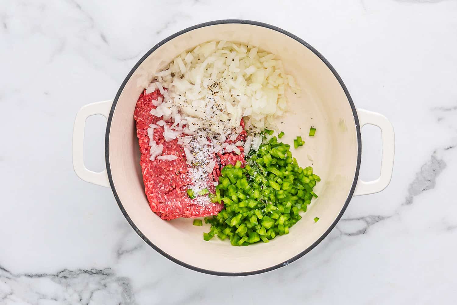 Uncooked beef, onions, green peppers.