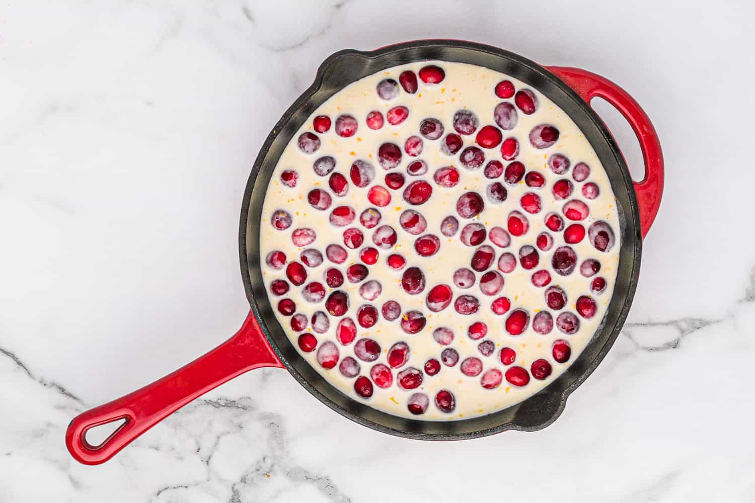 Unbaked cranberry clafoutis.