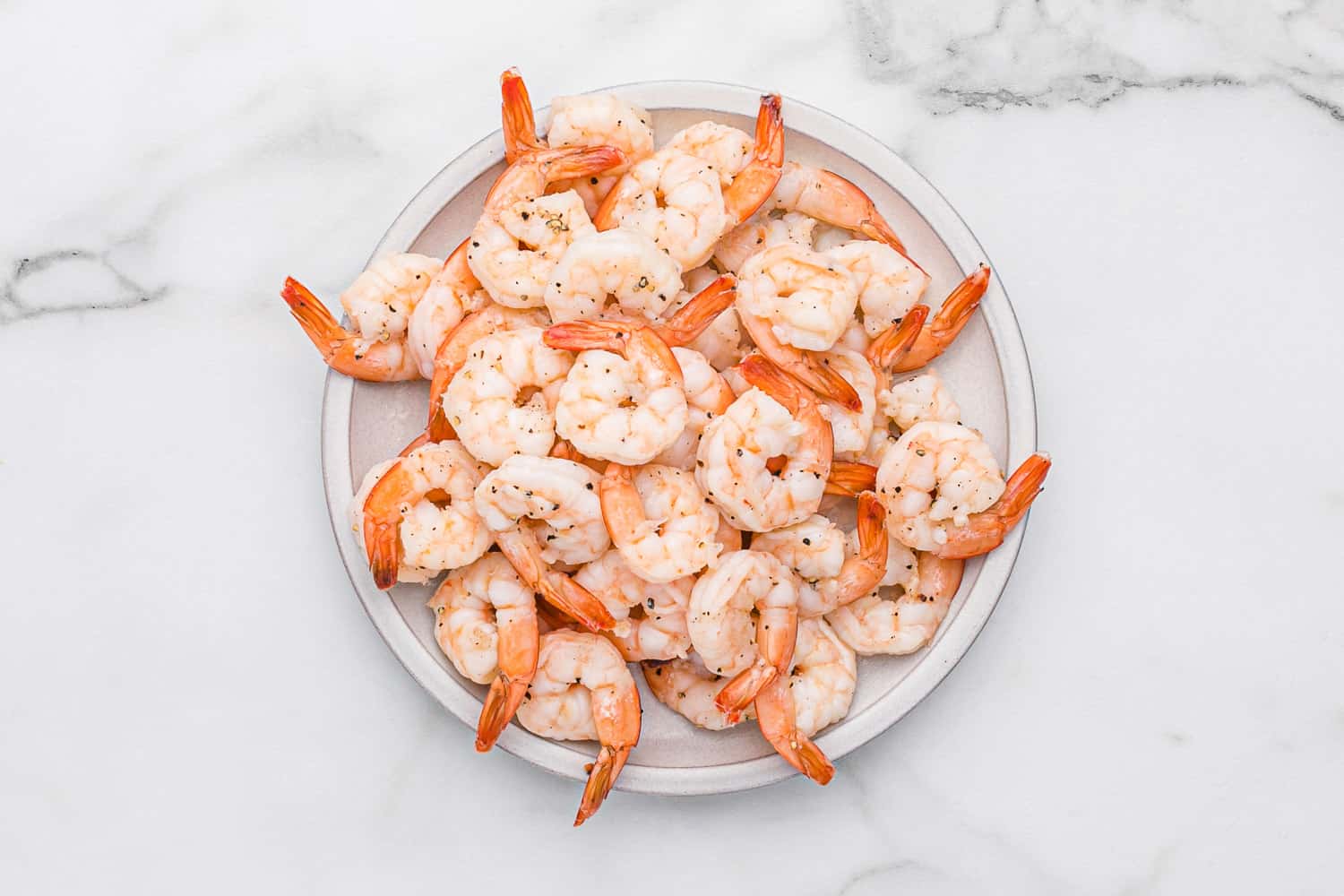 Cooked shrimp on a plate.