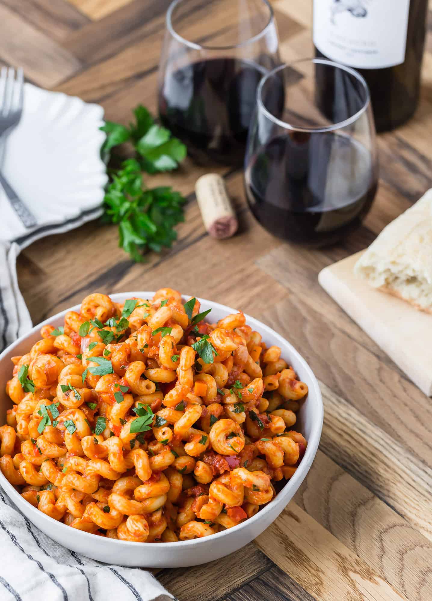 Pasta in a tomato sauce in white bowl.