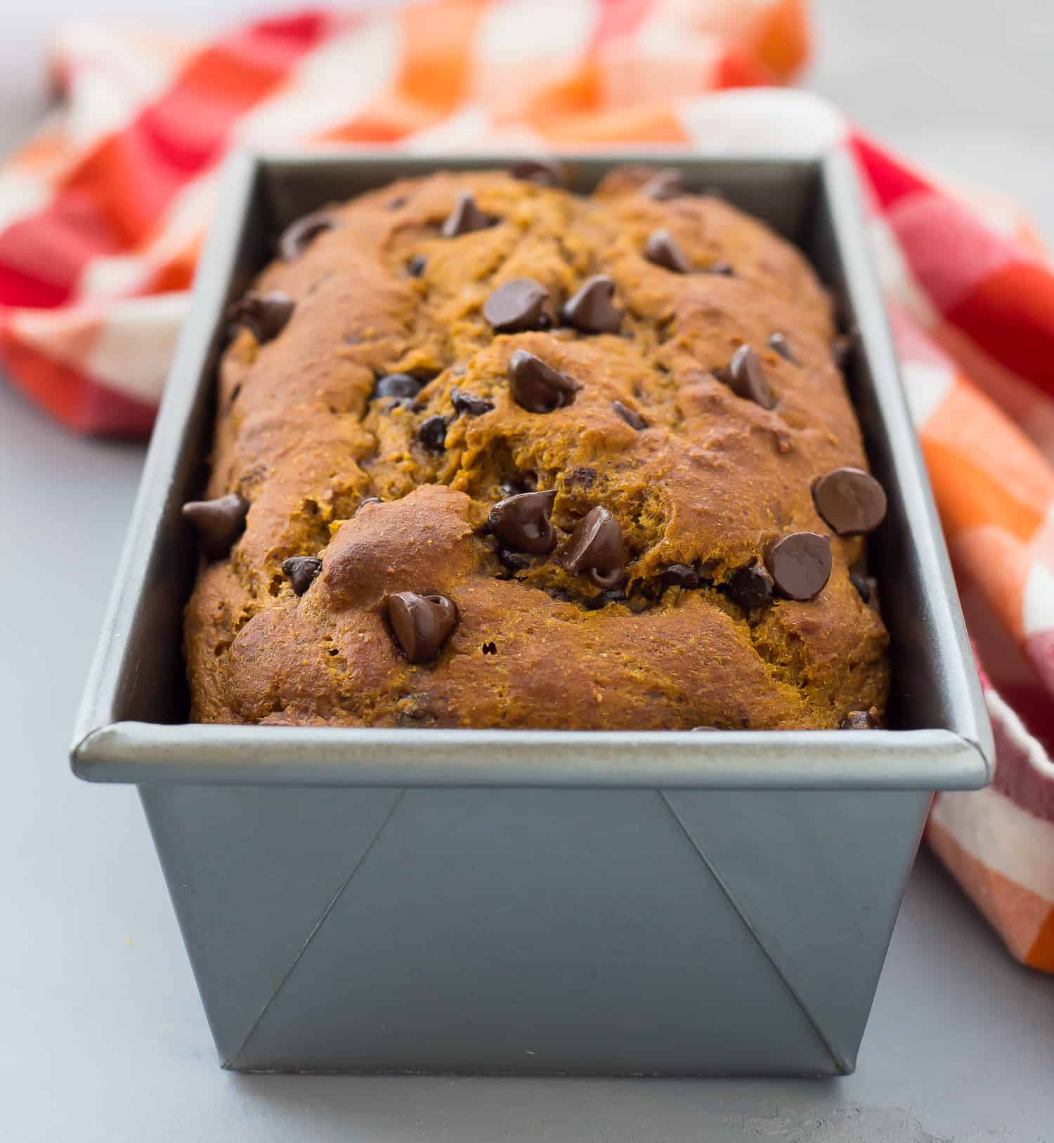 Pumpkin chocolate chip bread in a loaf pan.