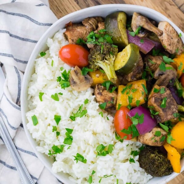 Chicken, vegetables, and rice in a bowl.