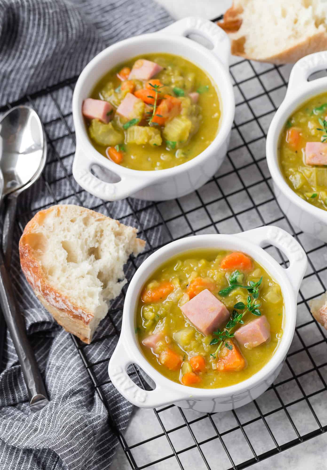 Pea soup in bowls with fresh thyme.