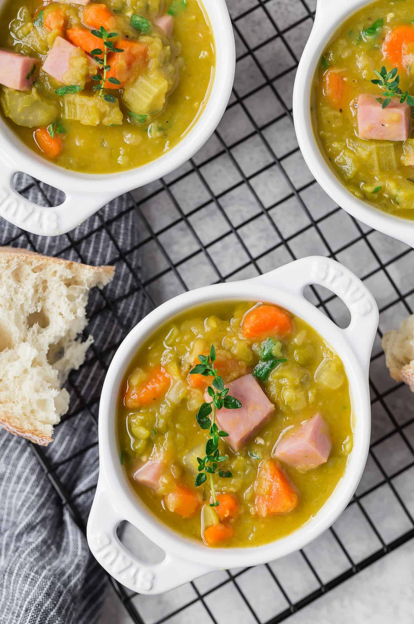 Green pea soup in small white bowls.