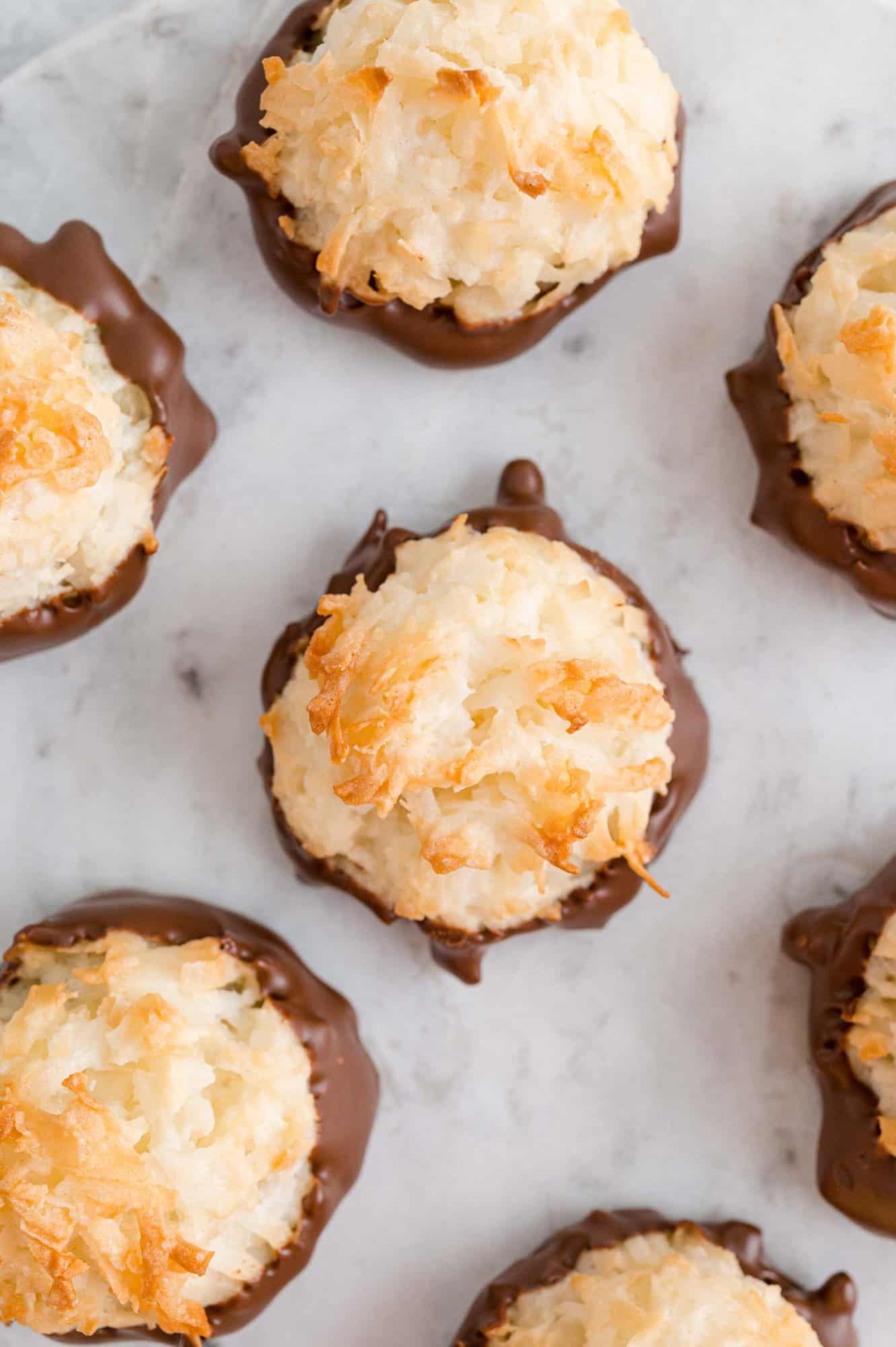 Overhead view of chocolate dipped coconut macaroons.