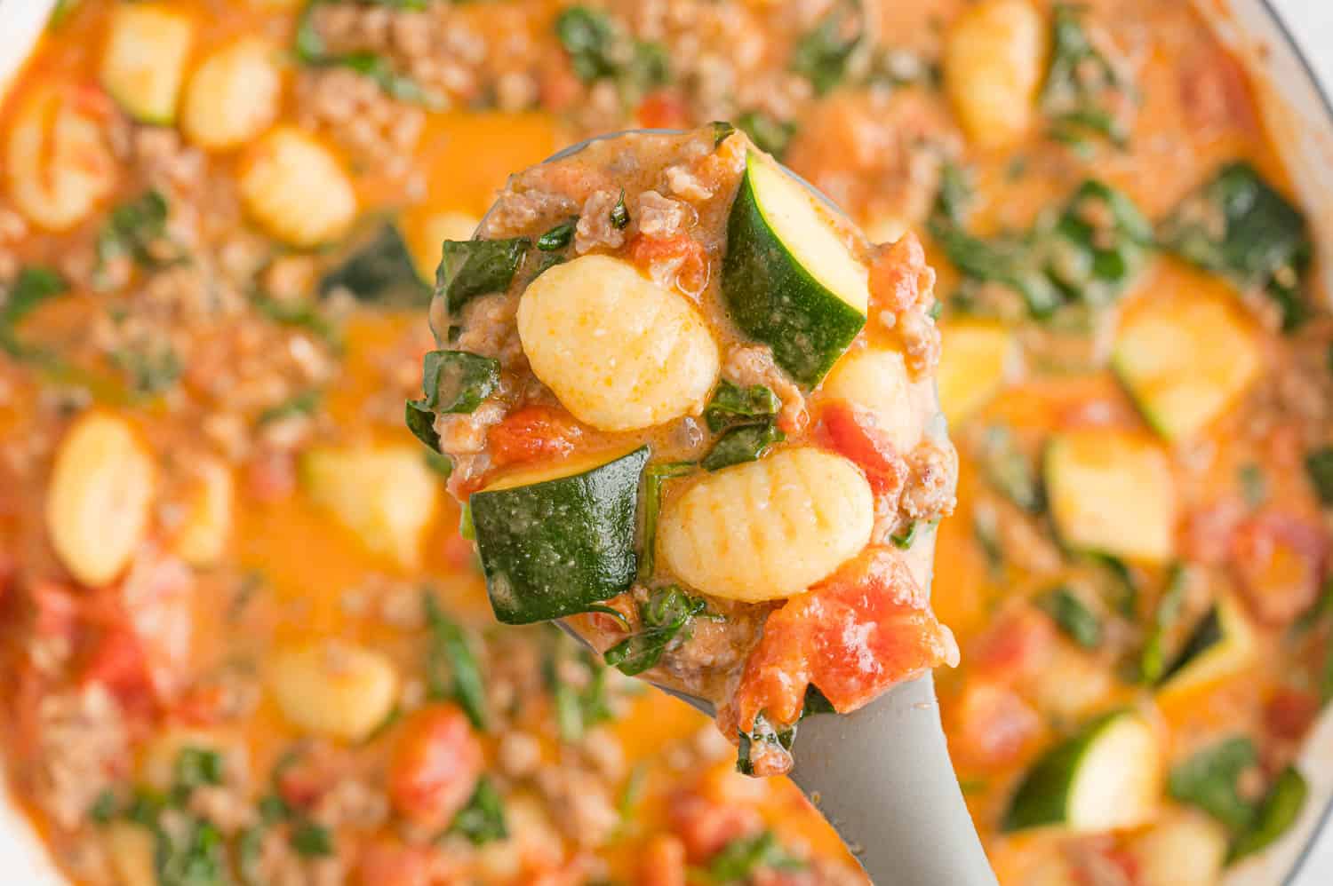 Gnocchi mixture on a serving spoon.