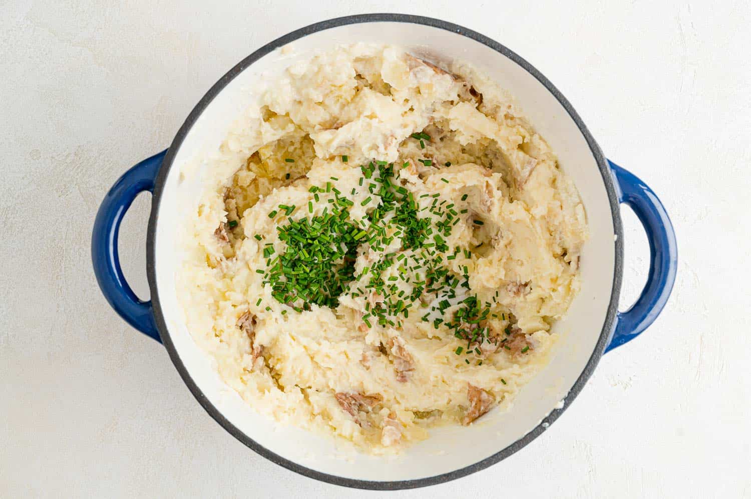 Chives added to mashed potatoes.