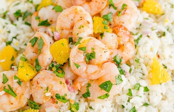 Shrimp and citrus on rice.