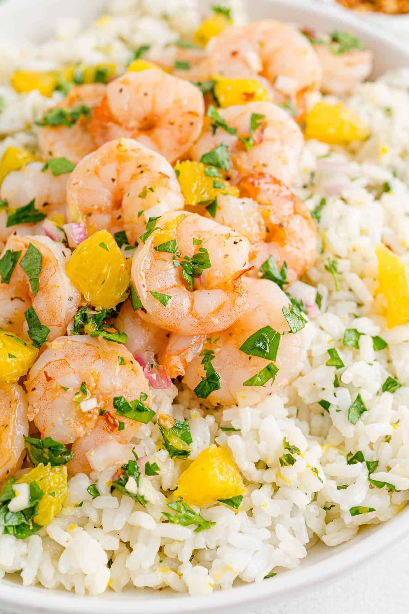 Shrimp with chimichurri rice and oranges.