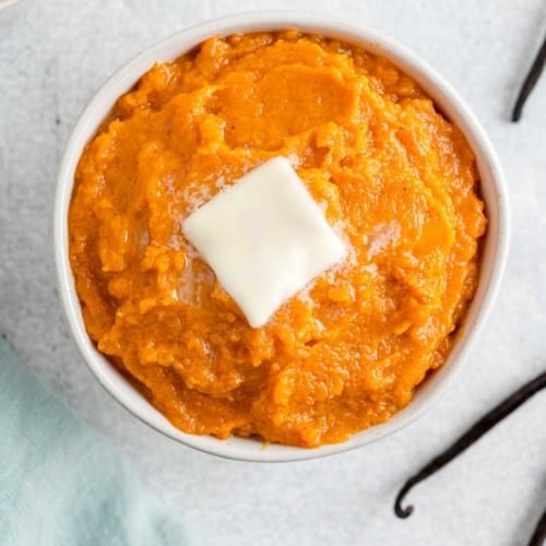 Vanilla bean mashed sweet potatoes in a round bowl.