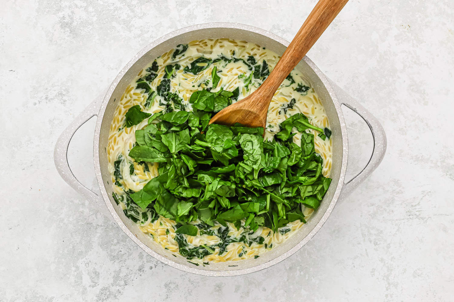 Spinach added to pan.