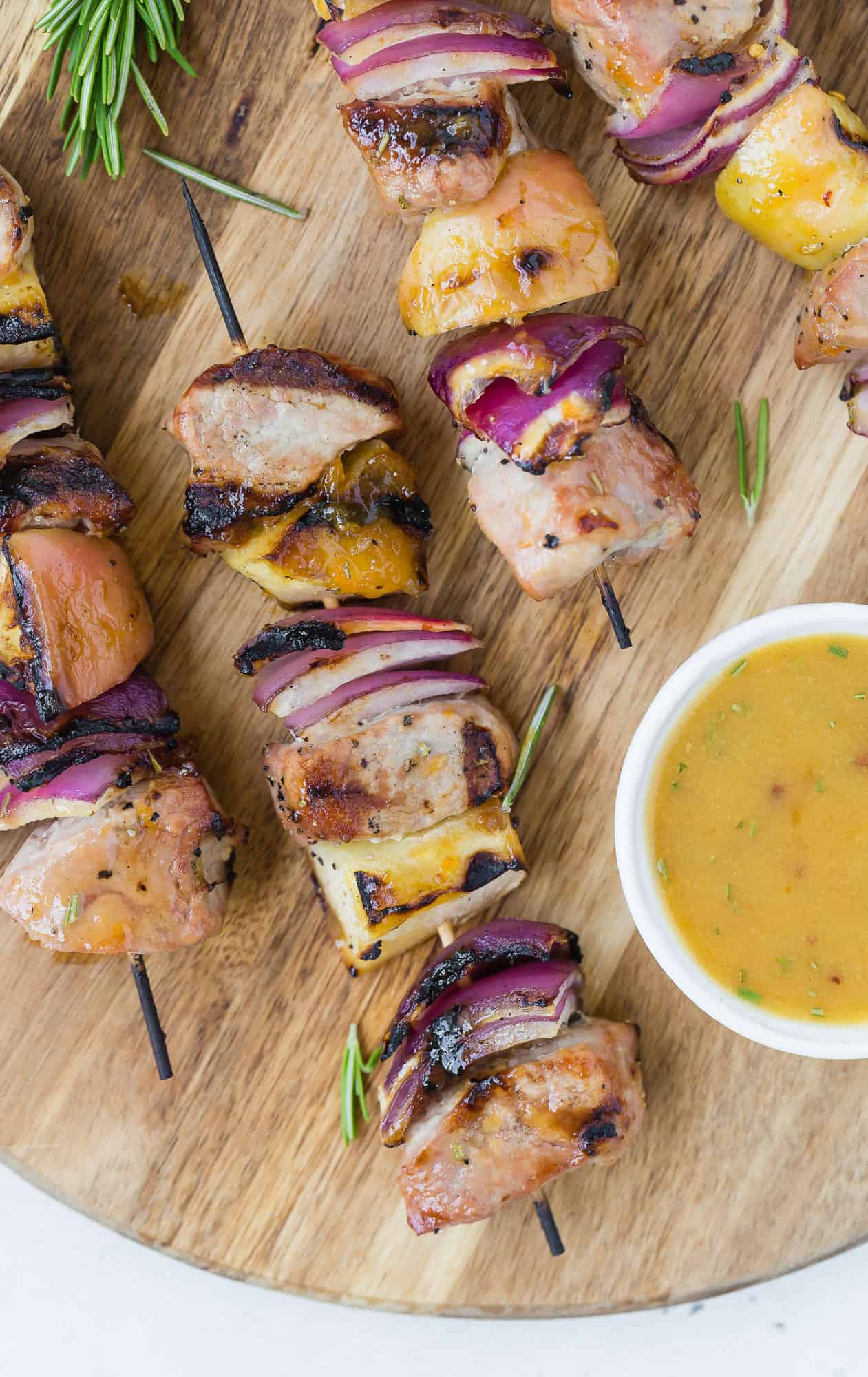 Pork Kebabs on a wooden cutting board.