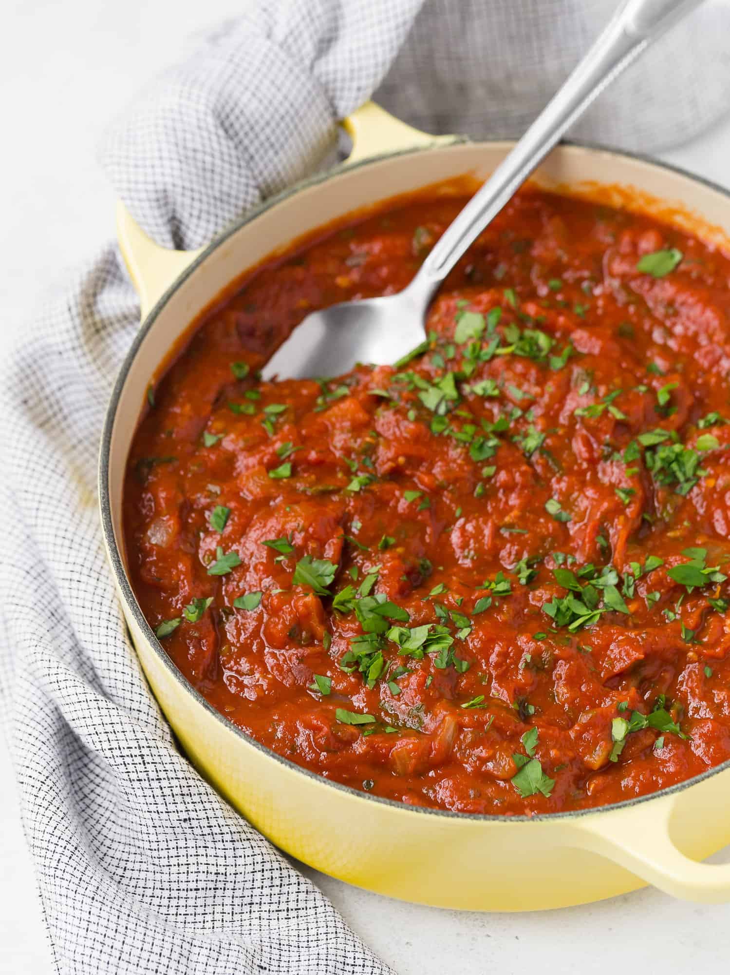 Homemade spaghetti sauce in a yellow pot.