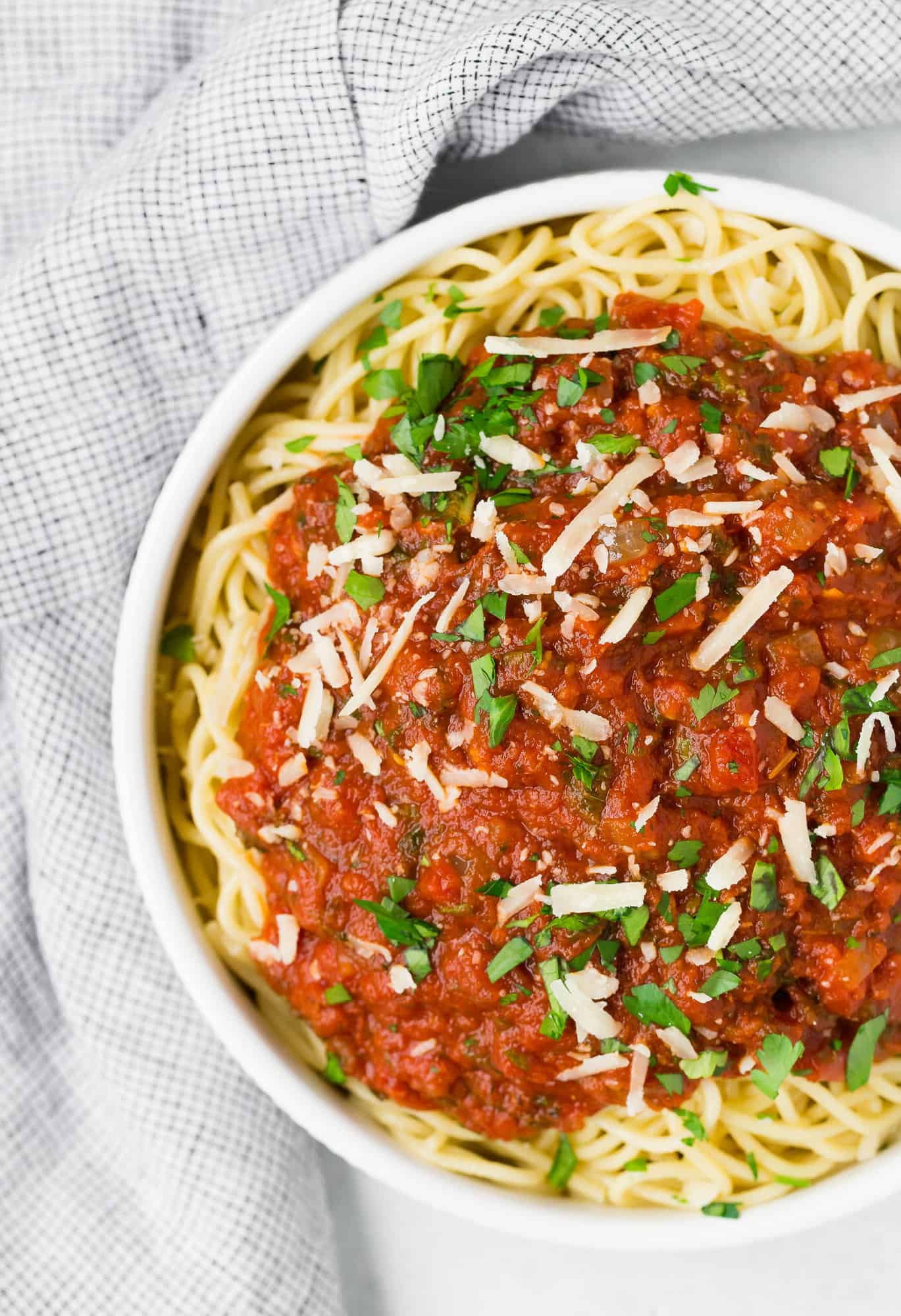 Spaghetti in a white bowl with classic marinara.