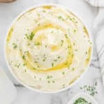 Instant pot mashed potatoes in a white serving bowl.