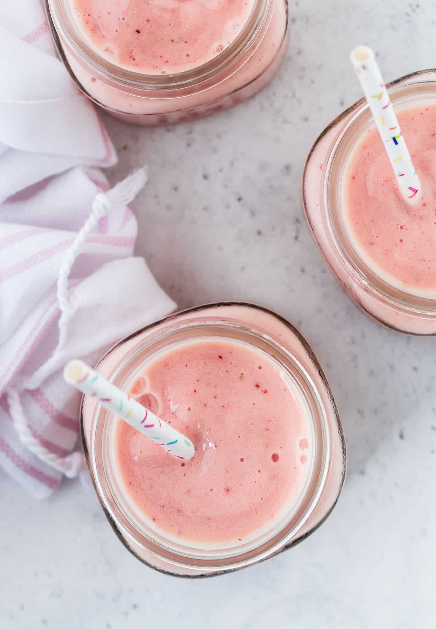 Overhead view of three smoothies.