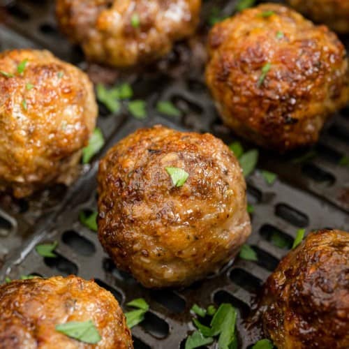 Air fryer meatballs still in air fryer.