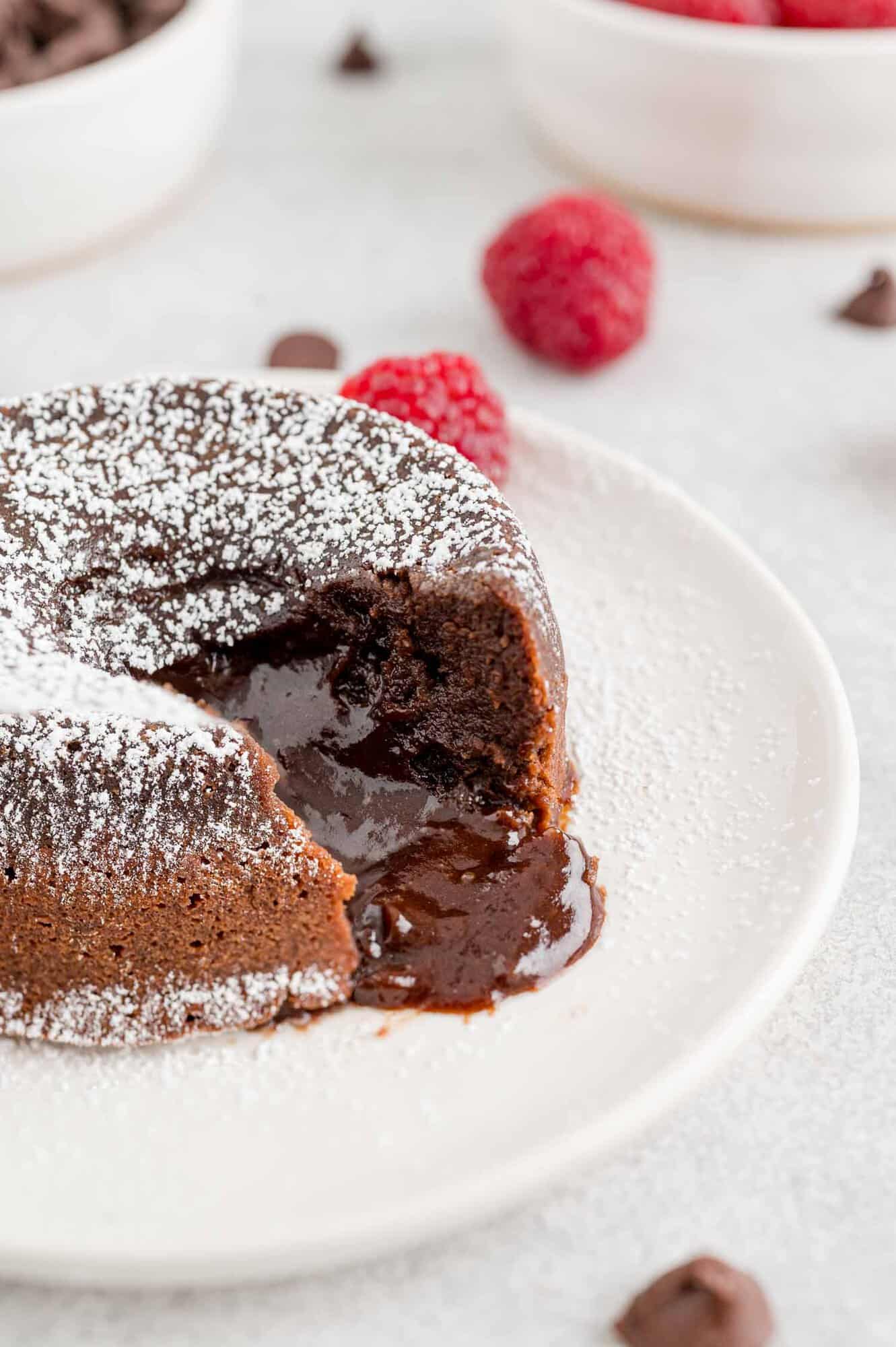 Chocolate lava cake with chocolate inside oozing out.