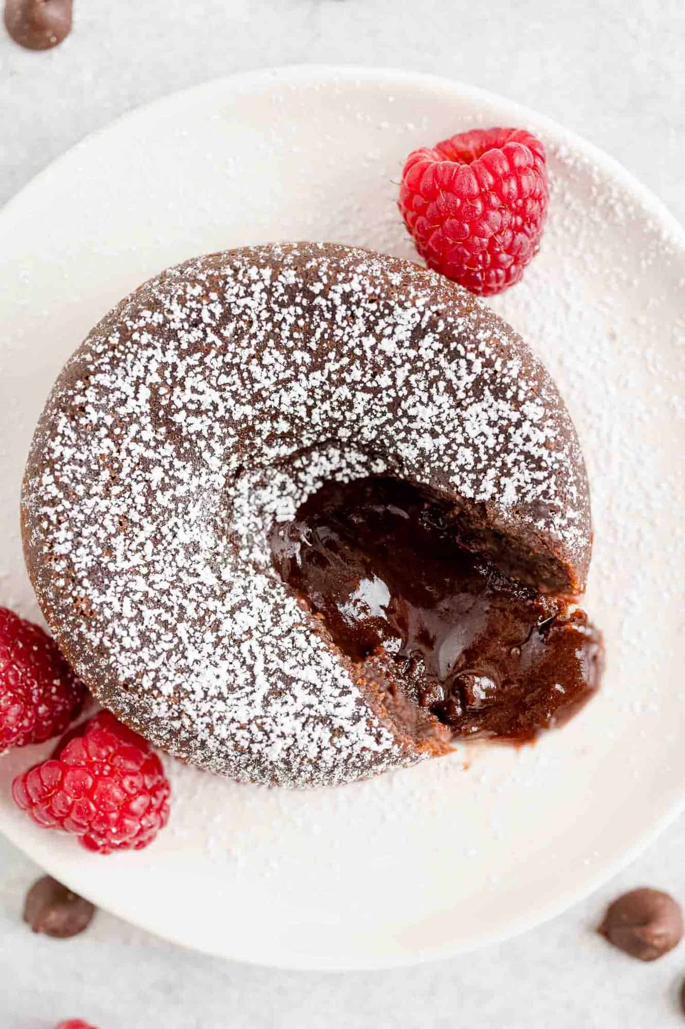 Chocolate filling oozing out of powdered sugar dusted cake.